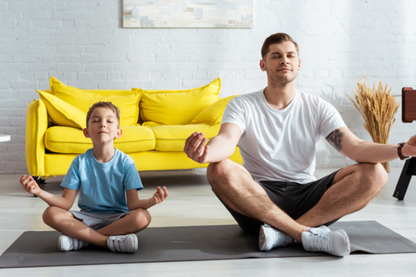 Father and son doing yoga